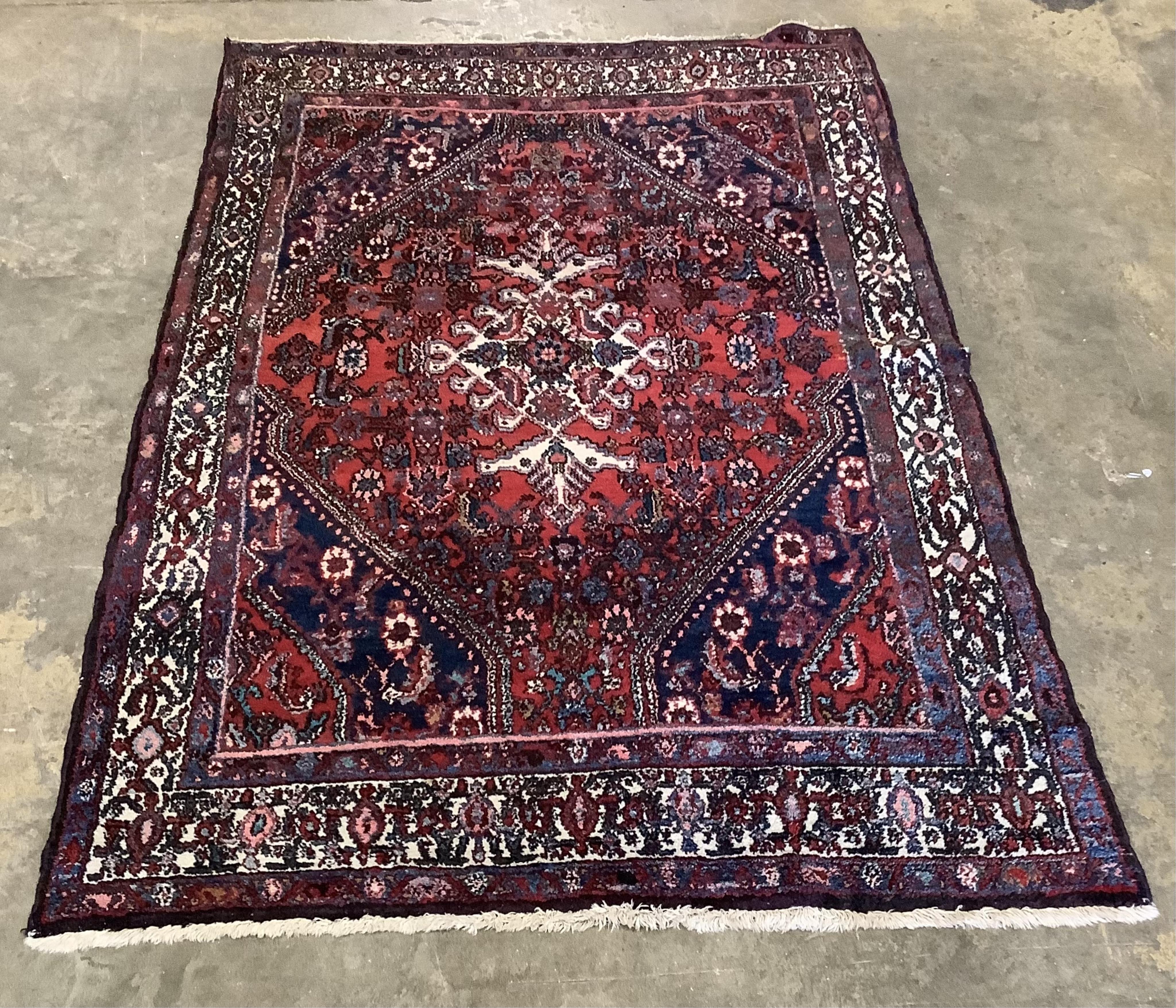 A Hamadan rug, 215 x 130cm and a Malayer rug, 190 x 125cm. Condition - poor to fair